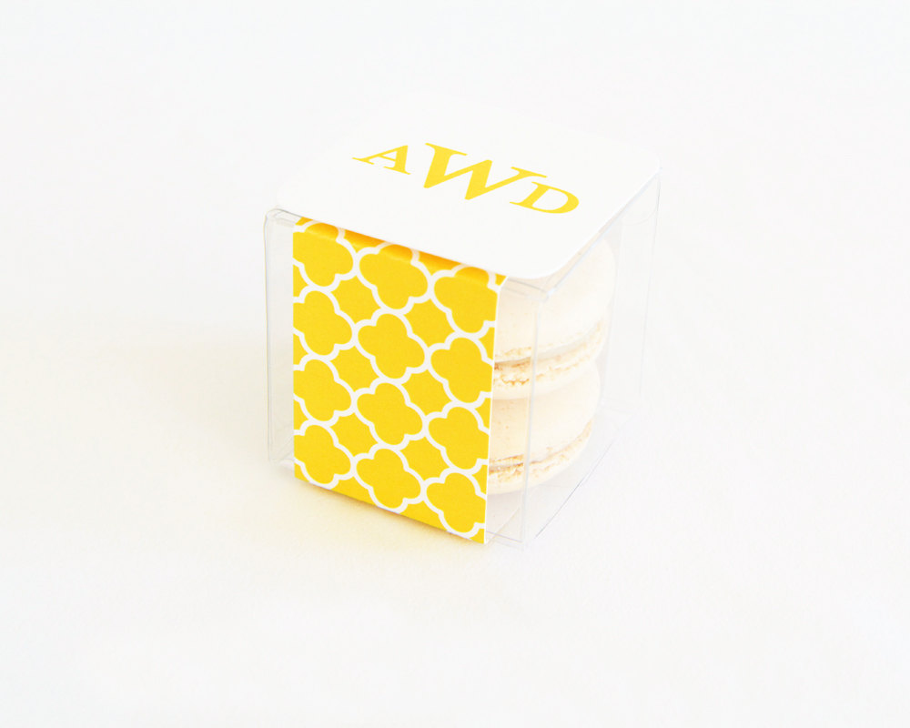 yellow quatrefoil macaron favor box | via 7 Things to Know About Giving Macaron Favors https://emmalinebride.com/favors/giving-macaron-favors/